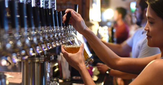 bartender pouring a beer