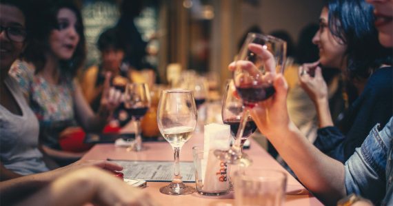 People at a table drinking and talking