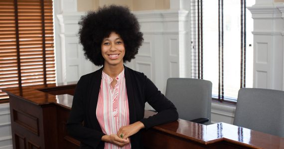 Mariah Parker stands in the commission chamber