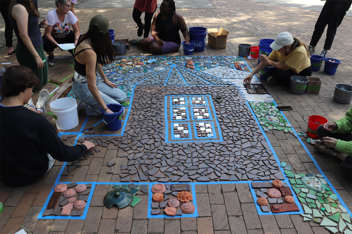 The Linnentown mosaic being installed