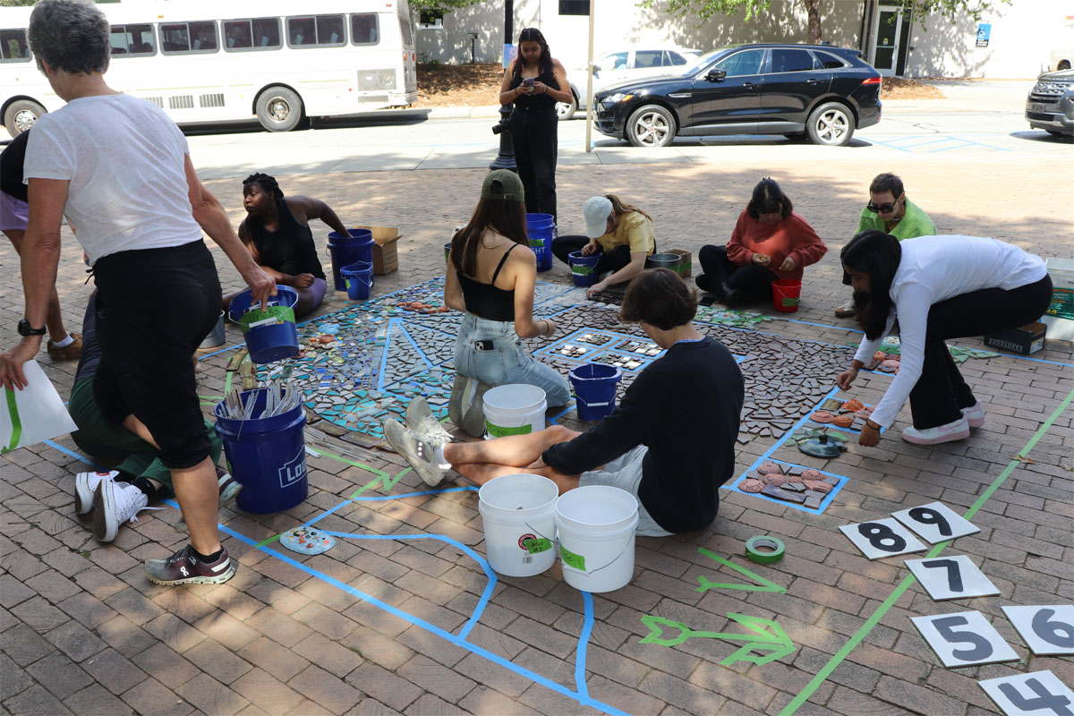The Linnentown mosaic being installed
