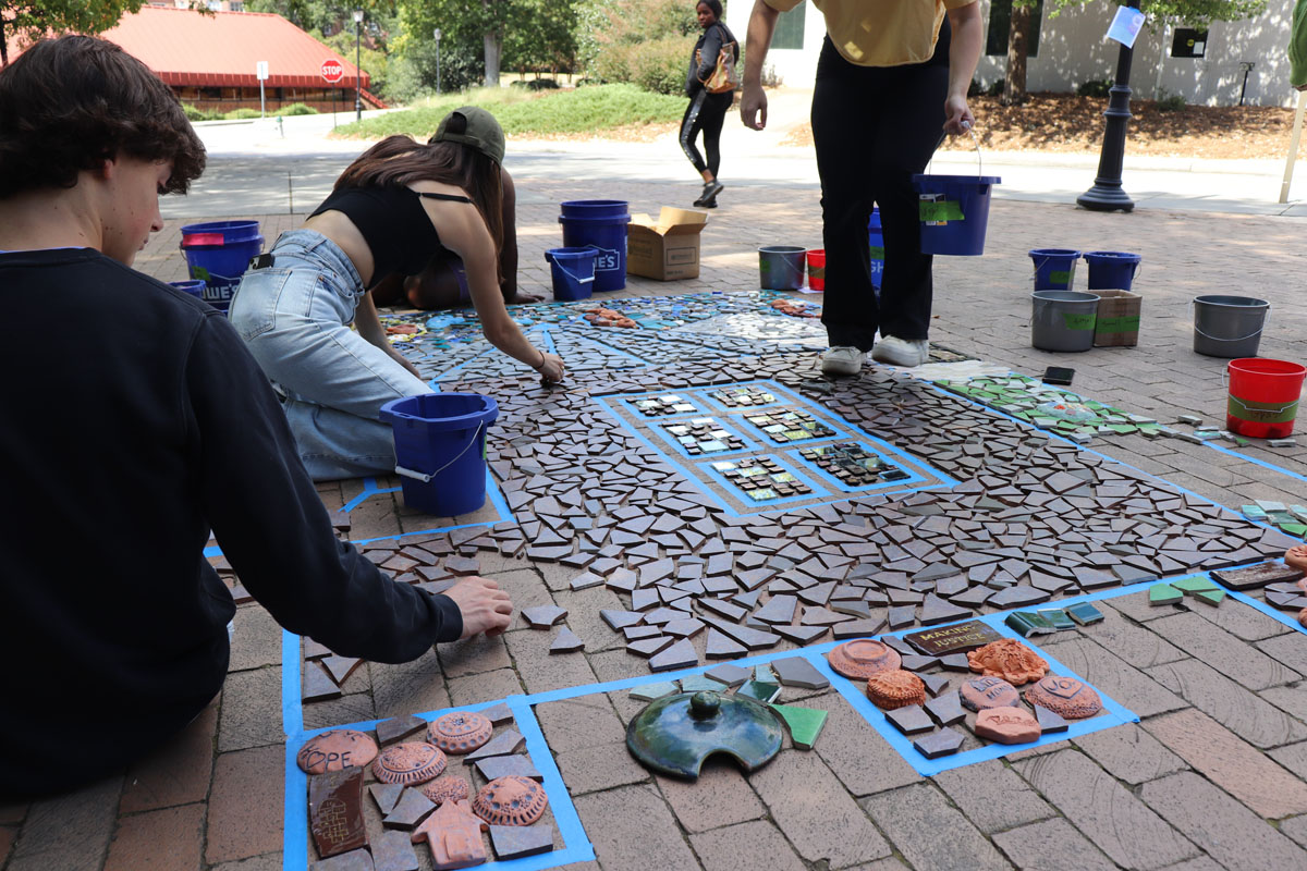The Linnentown mosaic being installed