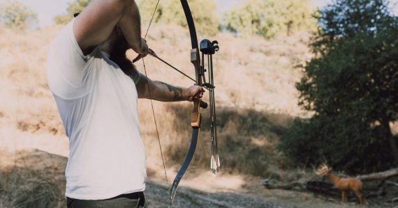 A bow hunter taking aim