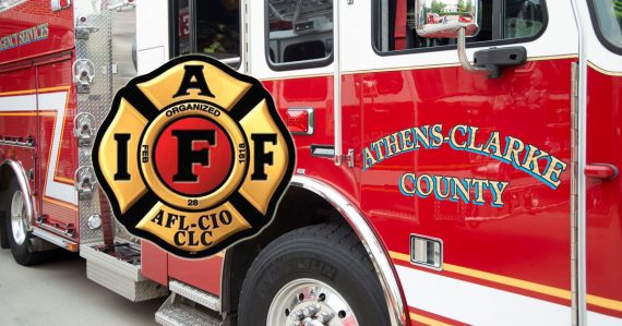 International Association of Firefighters logo over an ACC fire engine