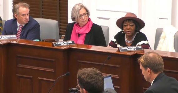 Ovita Thornton speaking behind the rail
