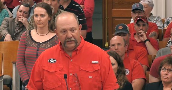 Firefighter speaks at a podium