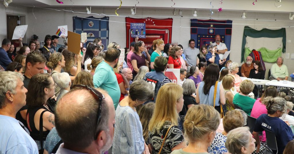 LGBTQ supporters and some anti-LGBTQ protestors pack the Oconee County Library Board meeting on July 10, 2023.