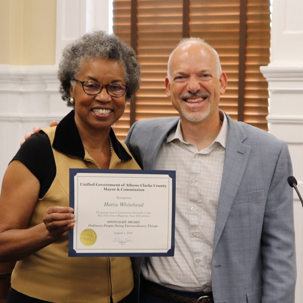 Hattie Thomas Whitehead receives a certificate of honor from Mayor Kelly Girtz