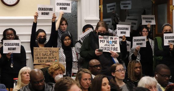 Students for Justice in Palestine hold signs in support of a Gaza ceasefire