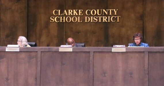 Commissioners sitting at the school board offices