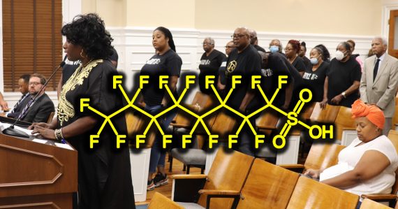 The Pittard Road stakeholders speak with a menacing chemical symbol in the foreground.