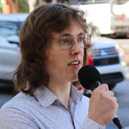 Jacob Harris with a microphone